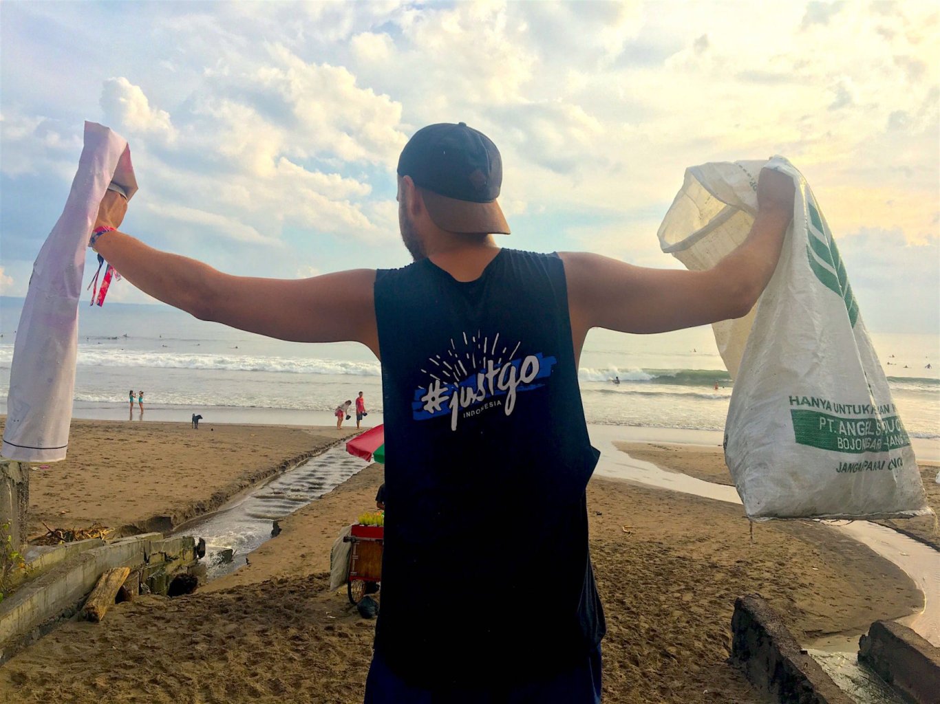 Bali Beach clean - man picking up rubbish