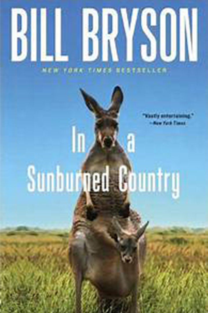 In a sunburned country book cover with blue sky and kangaroo hoping in background