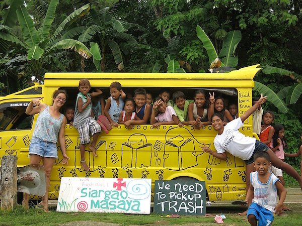 Siargao Masaya  - local children in van with 'picking up trash' sign