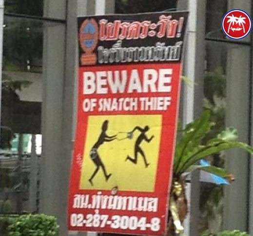 'Beware of the snatch theif' sign in Thailand