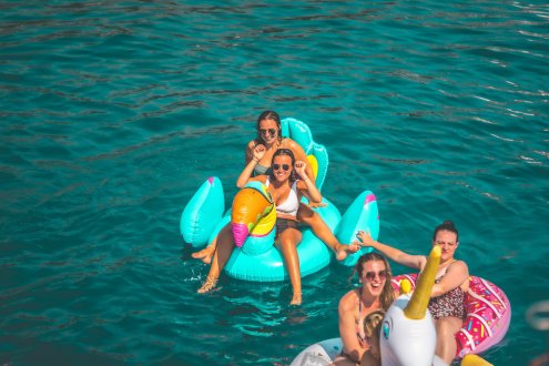 Group of people on inflatables at Floatilla party, Croatia 