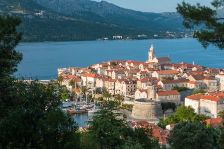 The island of Korcula in Croatia showing the blue sea, green landscape and terracotta houses