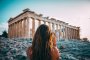 A girl standing at the  ancient ruins in Athens, Greece 