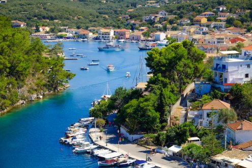 An aerial view of the town Lakka, in Paxos Greece with boats on the water  