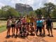 Group of travellers standing in front of Sigiriya rock