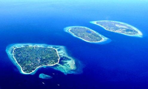Birds eye view of three gili islands surrounded by blue sea