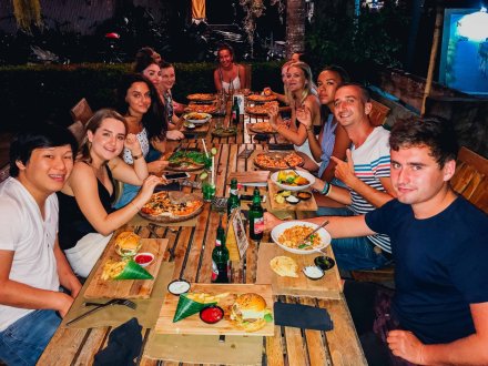 Group of travellers having dinner in Bali