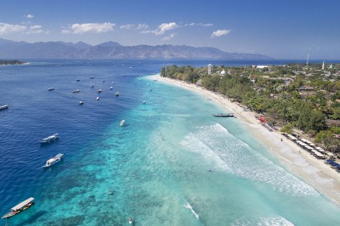 sky view of Gili T coastline with boats on the sea 