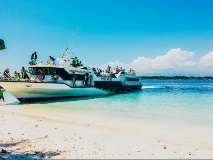 The ferry from Bali arriving in Gili Trawangan, showing the crystal clear blue sea and white sandy beach