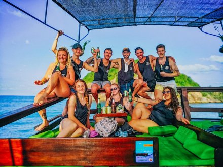 A group photo on a boat with a few chang beers in Koh Phangan Thailand