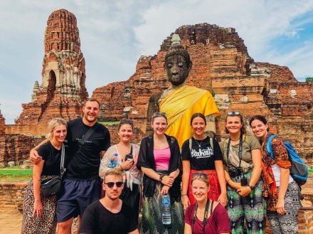 A group photo in front of the ruins in Ayutthaya Thailand