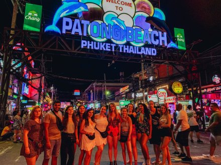 A group picture at the lively and colourful streets by Patong beach Thailand 