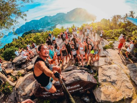 A group selfie at the viewpoint in Koh Phi Phi, Thailand as the sun is about to set 