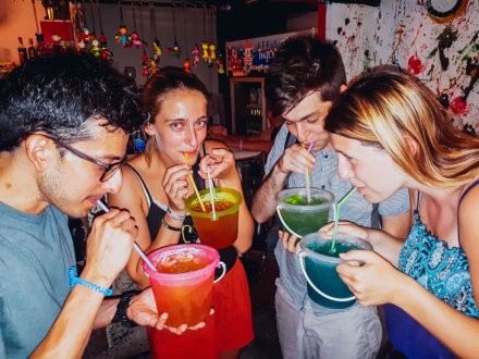 A group in Bangkok Thailand drinking out of the infamous bucket