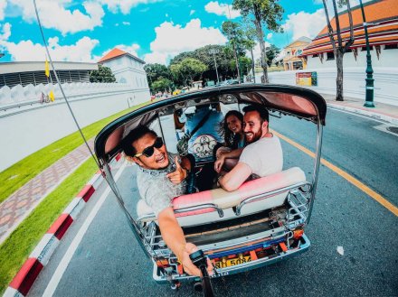 3 people laughing in tuk tuk in Thailand using a gopro to take photo 